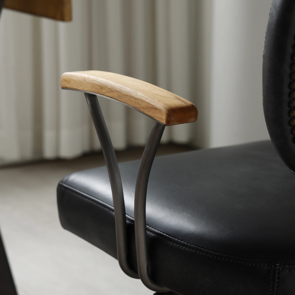 Sedia da ufficio ergonomica girevole con rotelle in pelle premium e struttura in metallo per ufficio domestico nera