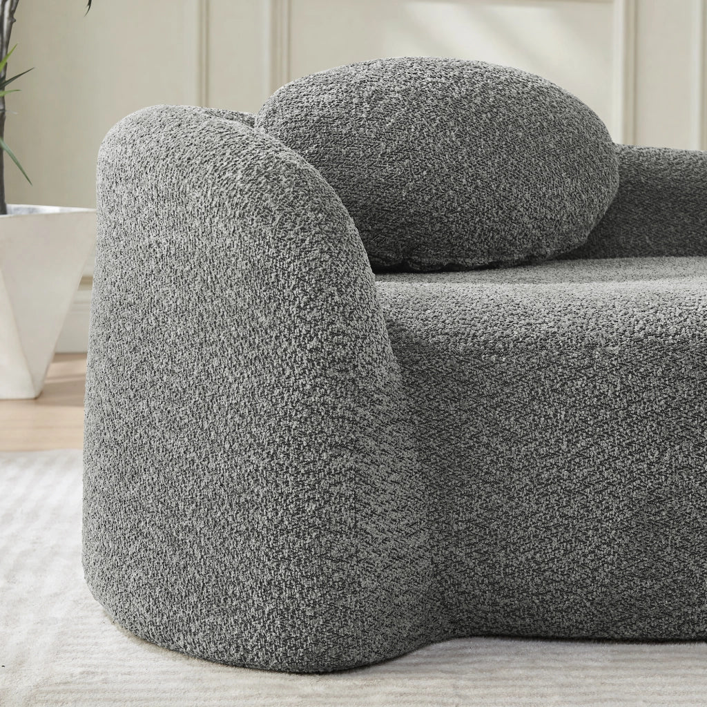 Divano in Teddyfleece con design arrotondato, cuscino di supporto e struttura compatta, colore grigio scuro