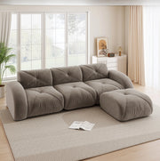 Divano modulare in chenille taupe con pouf; struttura senza telaio e base antiscivolo