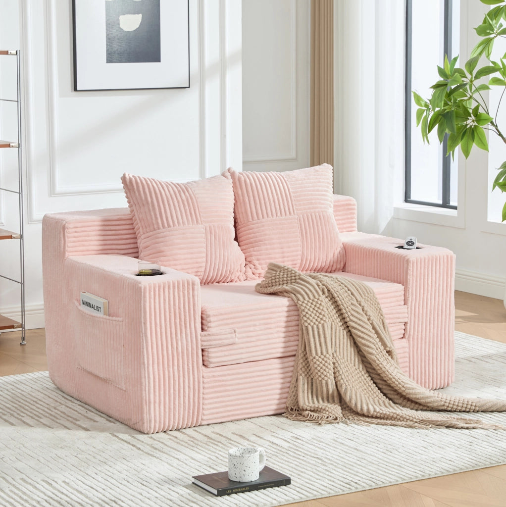 Divano pouf in velluto a coste rosa con tasche laterali e 2 cuscini; 151 × 133 × 64 cm