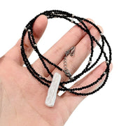 Collana girocollo di cristalli neri con lunghi fili di perle