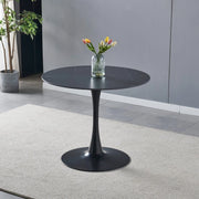 Tavolo rotondo Dot con piano in ceramica effetto marmo nero opaco con particolari oro e gamba nera