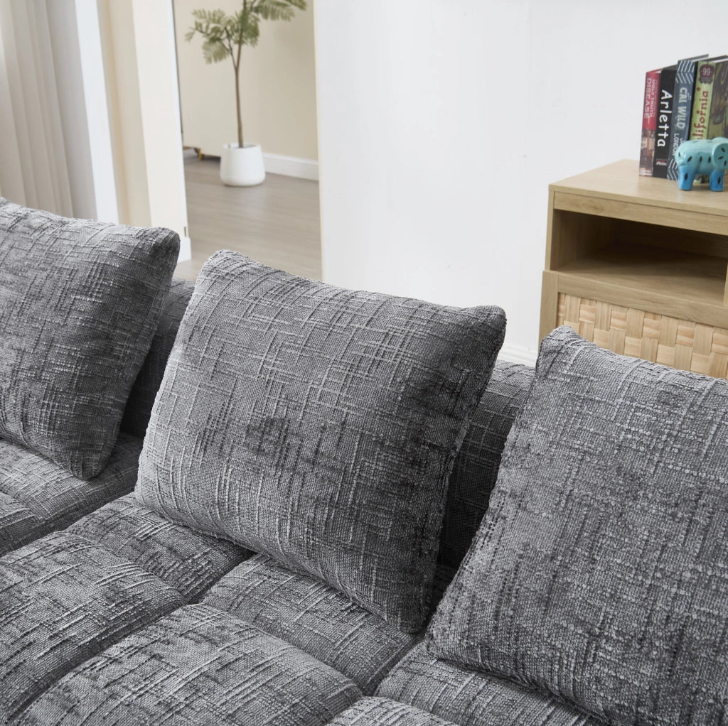 Divano componibile grigio in ciniglia con chaise longue e tasche