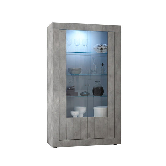 Libreria design con ampie porte in vetro e LED integrati, colore grigio scuro effetto cemento, collezione URBAN.