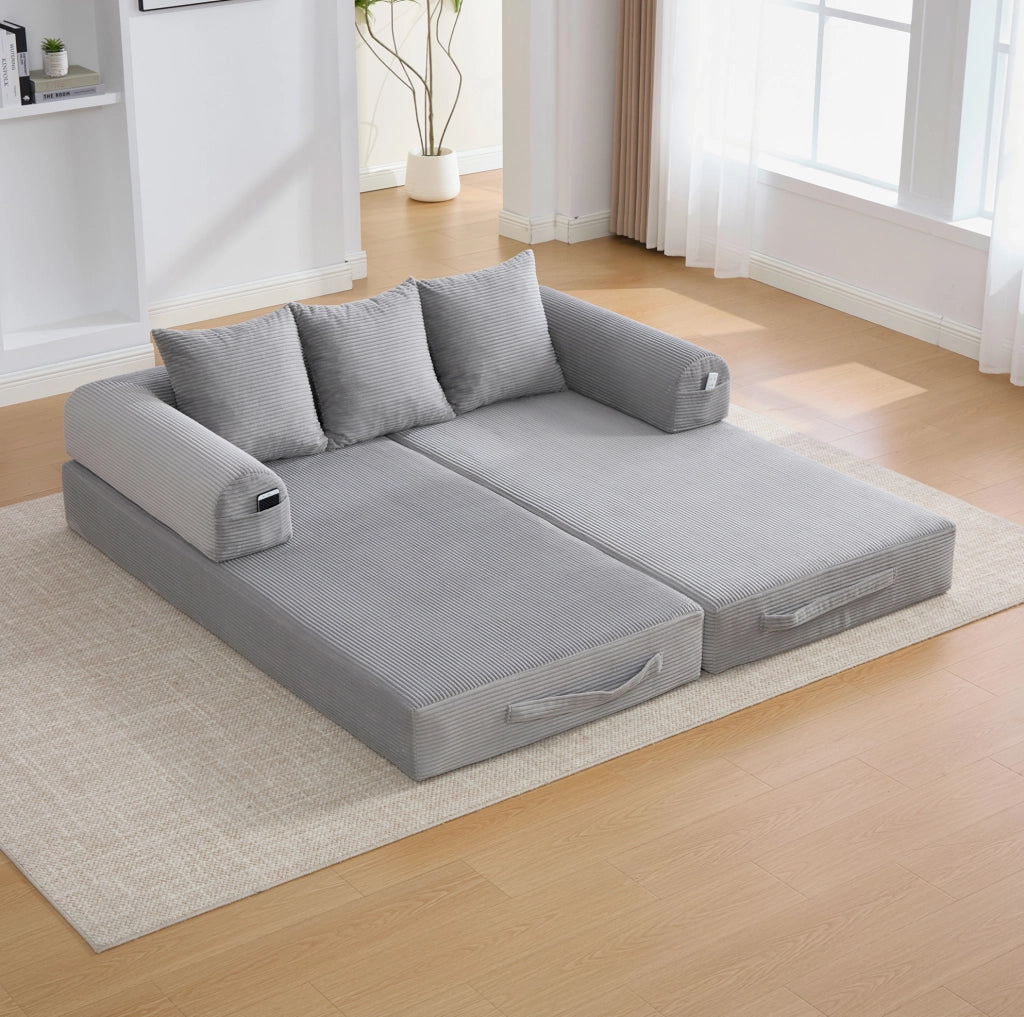 Divano modulare trasformabile grigio chiaro in velluto a coste con tre cuscini e tasche laterali