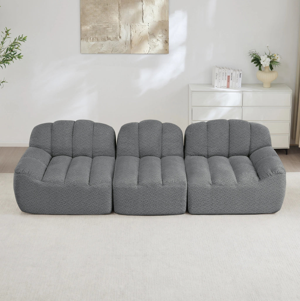 Divano modulare 3 posti con ottoman collegabile in fleece granulato grigio