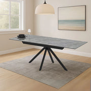Tavolo allungabile Perla con piano in ceramica effetto marmo grigio e gambe in metallo nero