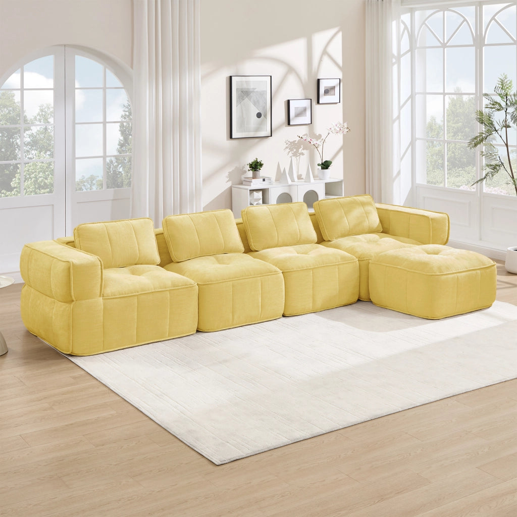 Divano modulare ad angolo senza struttura con pouf, seduta profonda e rivestimento in poliestere giallo per soggiorno
