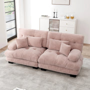 Divano angolare modulare con seduta profonda braccioli imbottiti cuscini lombari e decorativi in ciniglia rosa