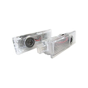 Kit Luci Led Logo Proiettori Auto Portiere BMW E60 E61 E63 E65 E66 E67 E68 E70 E71 E81 E83 E84 E85 E86 E87 E88 E90 E92 E93 F10 F01 F02