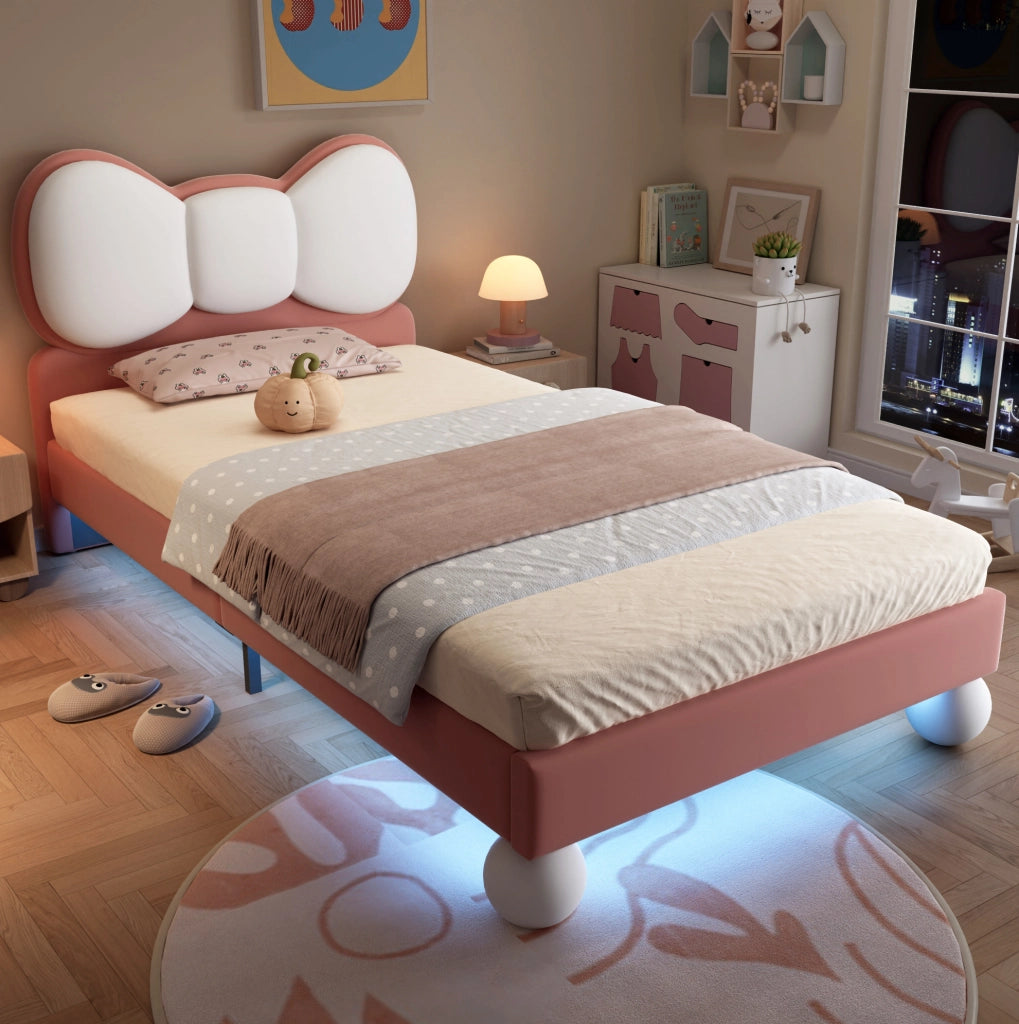 Letto imbottito per bambini 90x200 cm in velluto rosa con testiera a fiocco e LED