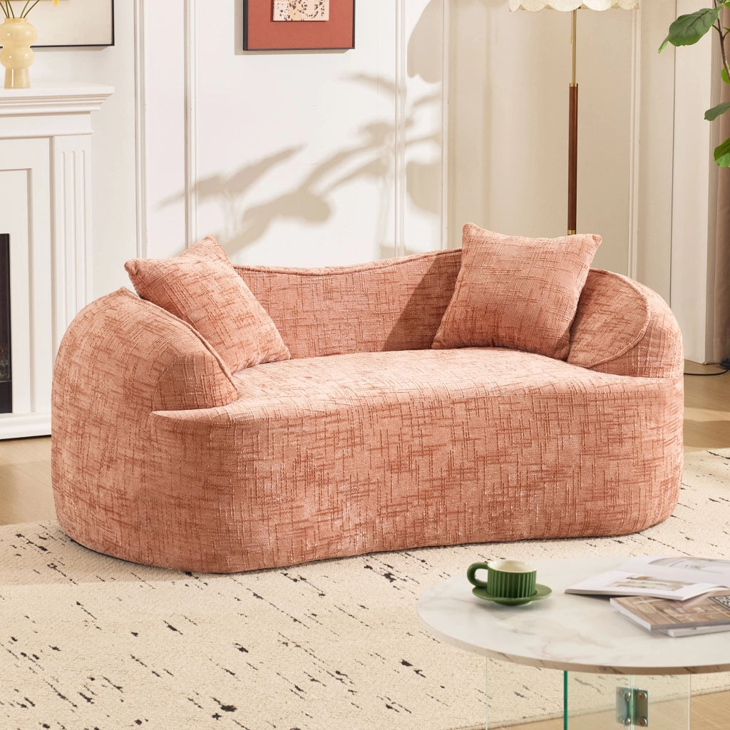 Divano curvo a due posti con supporto ergonomico e cuscini, in schiuma e molle rosa per soggiorno e camera da letto