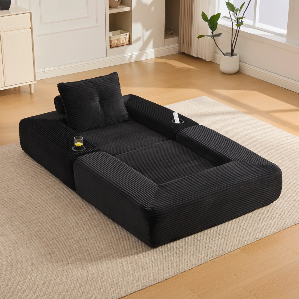 Divano convertibile in velluto a coste con molle, cuscini in memory foam, tasche laterali e portabicchieri nero