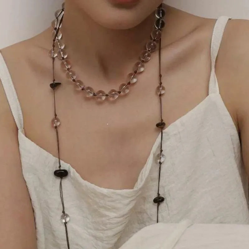 Collana in corda intrecciata e perle naturali: gioielli boho con nappe