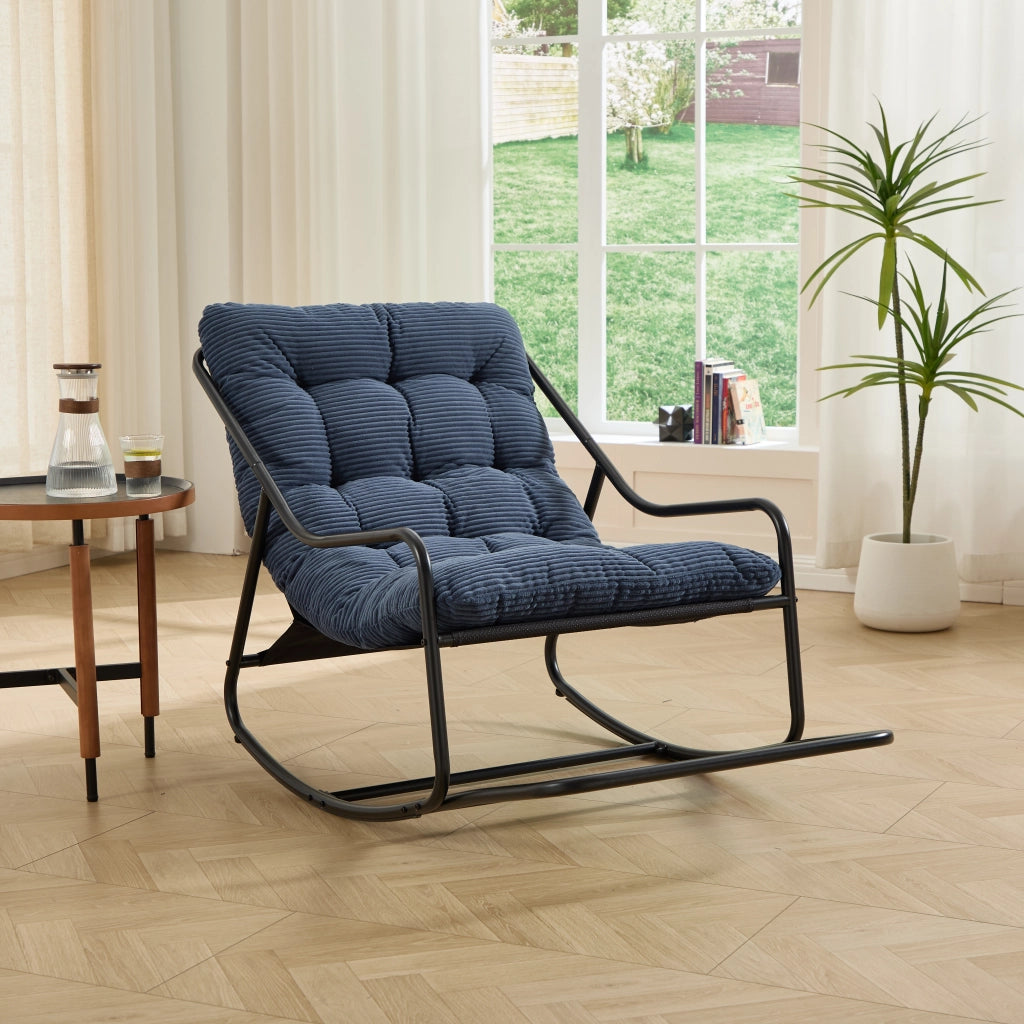 Sedia a dondolo con cuscino spesso in tessuto a coste blu navy, struttura in acciaio, 75 × 116 × 82 cm