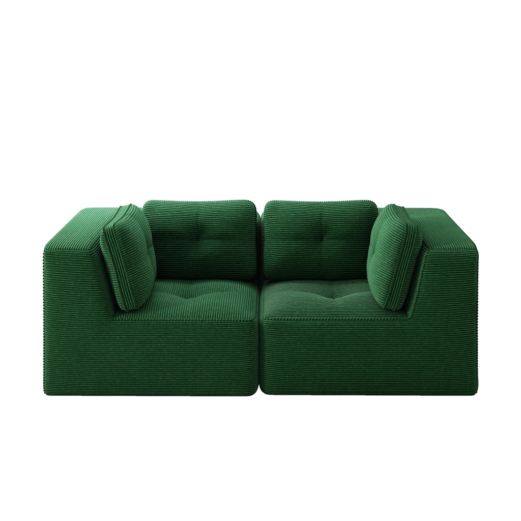 Divano angolare modulare senza struttura, rivestito in corduroy verde, con seduta profonda e comfort soffice