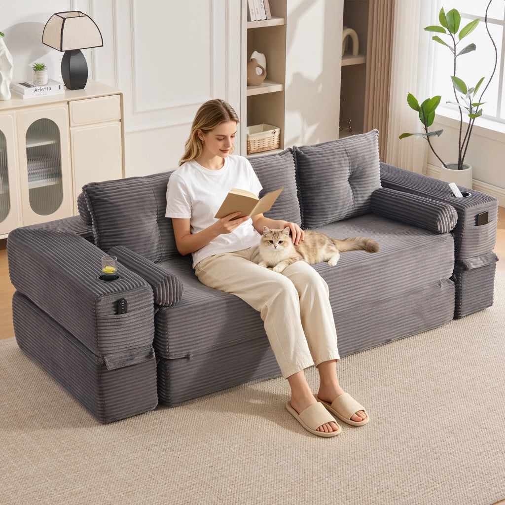 Divano letto convertibile modulare a 3 posti con tasche laterali e porta bicchieri in velluto a coste grigio scuro