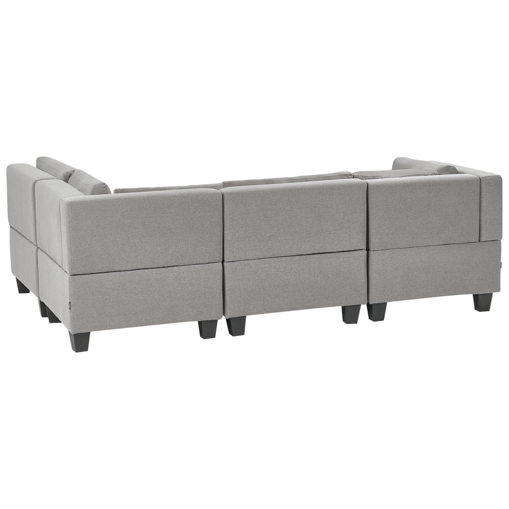 Divano componibile 4 posti imbottito in tessuto grigio chiaro con gambe nere schienale imbottito lato sinistro con pouf stile moderno