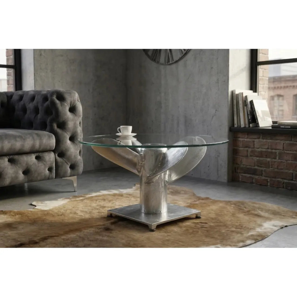 Tavolino basso ALUMIA rotondo 60 cm in alluminio argentato e vetro temperato – design industriale con piede a elica