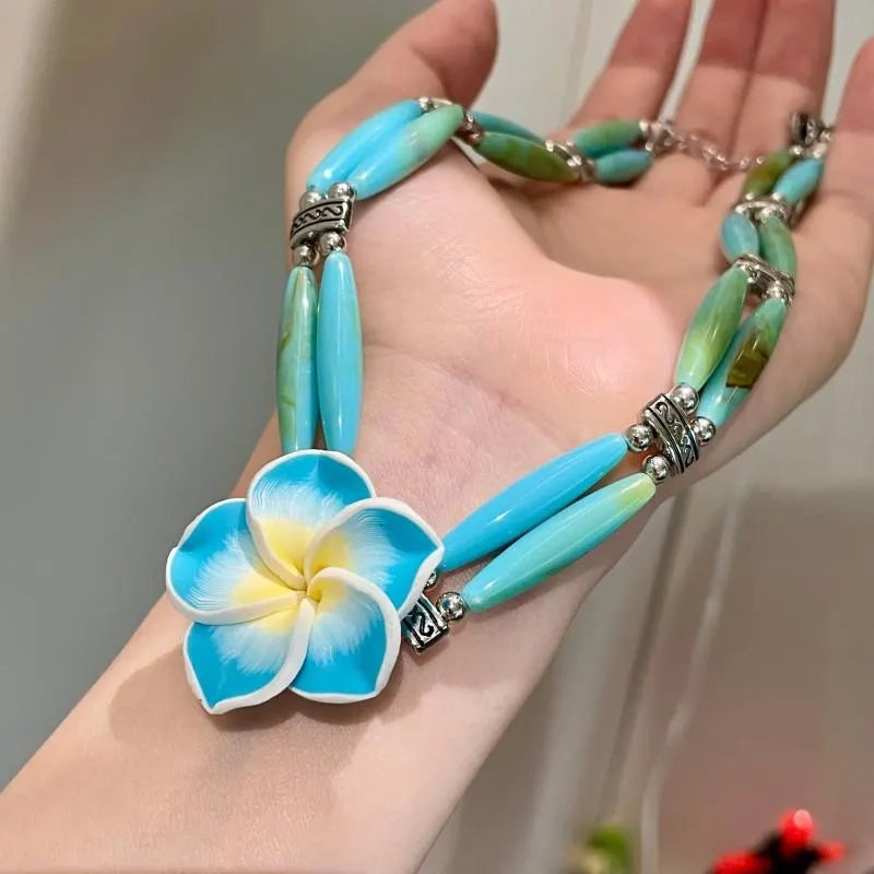 Collana fatta a mano con perline di cristallo e frangipani blu, regalo di Natale o compleanno.