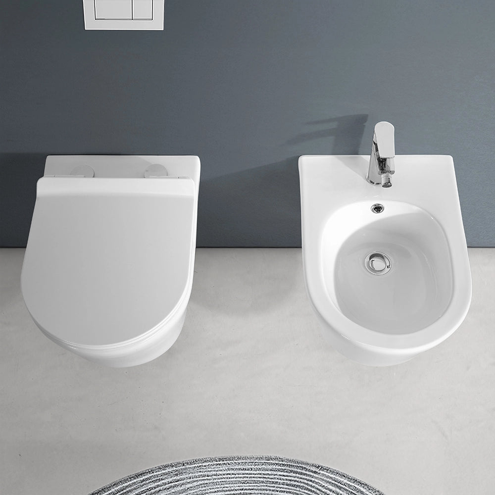 Sanitari Sospesi in ceramica bianco design tondo con copriwc e scarico rimless Ukra