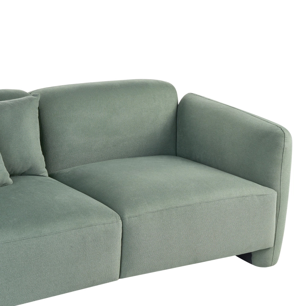 Divano imbottito minimalista a profilo ribassato a 3 posti con seduta profonda verde chiaro stile minimalista