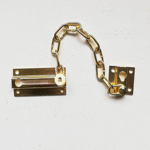 Catenella ottonata di sicurezza per porte