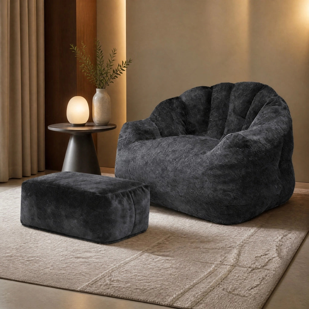 Fauteuil con pouf a petalo con schienale imbottito e seduta morbida in tessuto flanella nero per salotto e studio