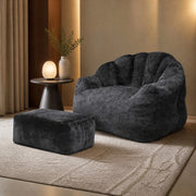 Fauteuil con pouf a petalo con schienale imbottito e seduta morbida in tessuto flanella nero per salotto e studio