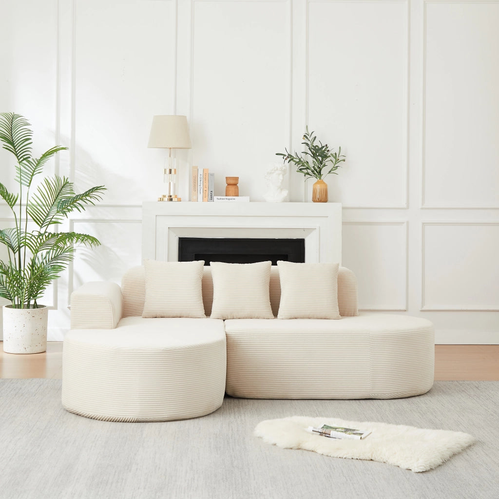 Divano modulare a L in velluto a coste beige con chaise longue curva; 220 cm
