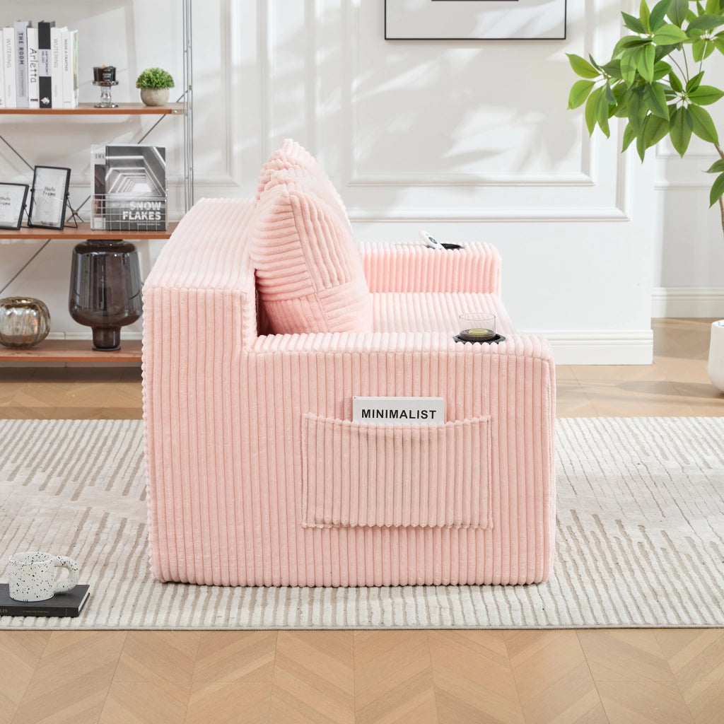 Divano tre posti in velluto a coste rosa; modulare salvaspazio con porta bicchieri