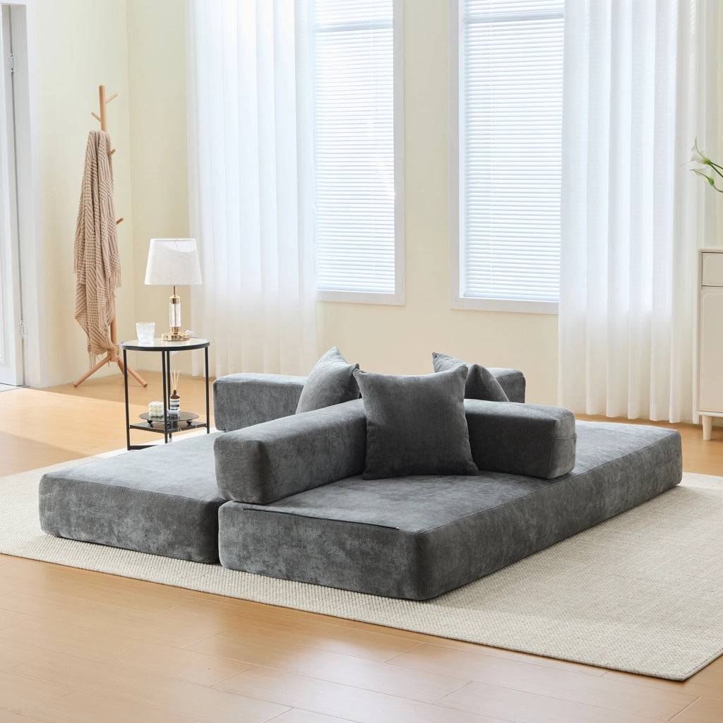 Divano modulare in chenille grigio scuro con tasche laterali, base antiscivolo e struttura componibile