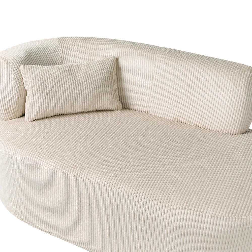 Chaise longue con rivestimento in velluto a coste beige e cuscino decorativo lato sinistro