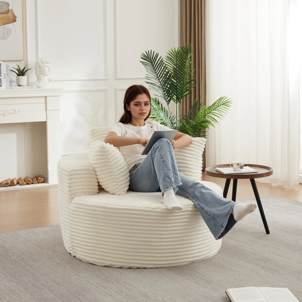 Poltrona lounge rotonda con braccioli larghi e 3 cuscini in velluto a coste, schiuma e molle, beige
