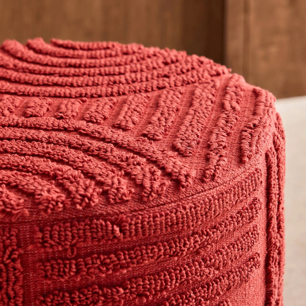 Pouf rotondo in bouclé testurizzato, terracotta