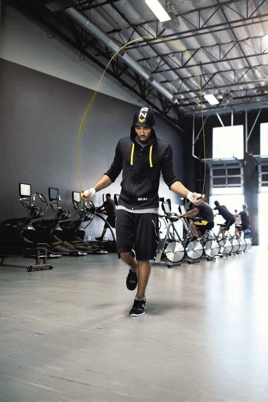 Apparecchio di training con cavo a velocità giallo-nero, unico modello con RockTape.