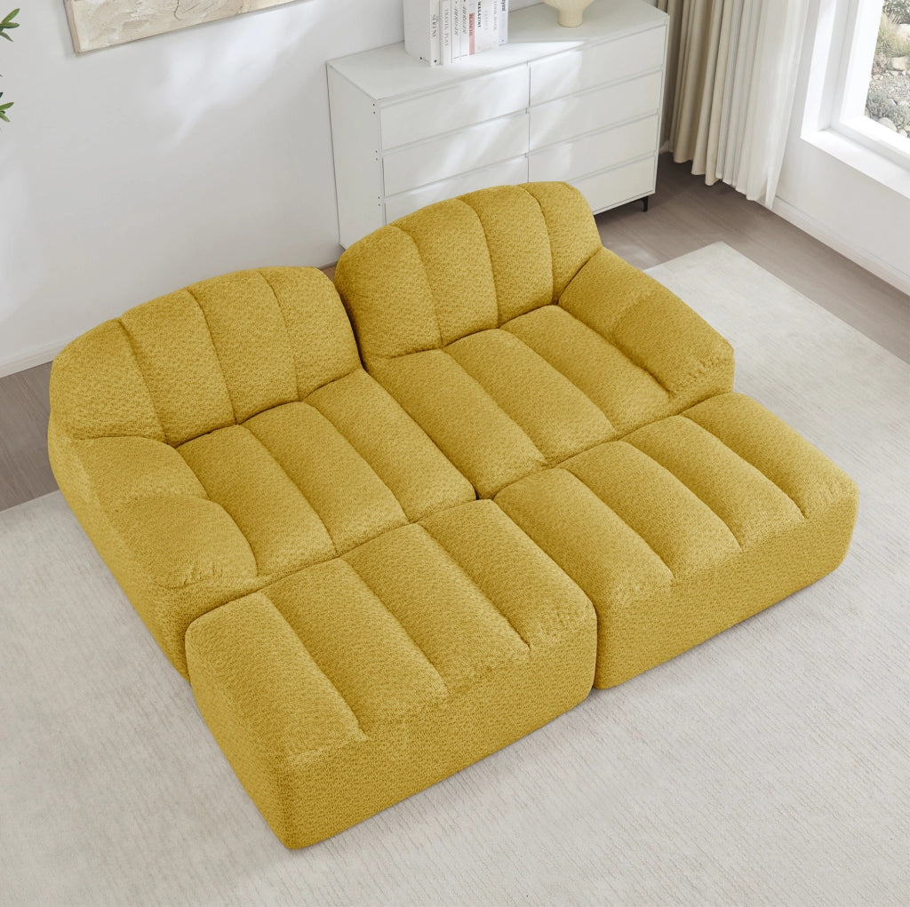Divano modulare 210x165x79 cm in fleece granulato giallo; design senza struttura con pouf collegabile