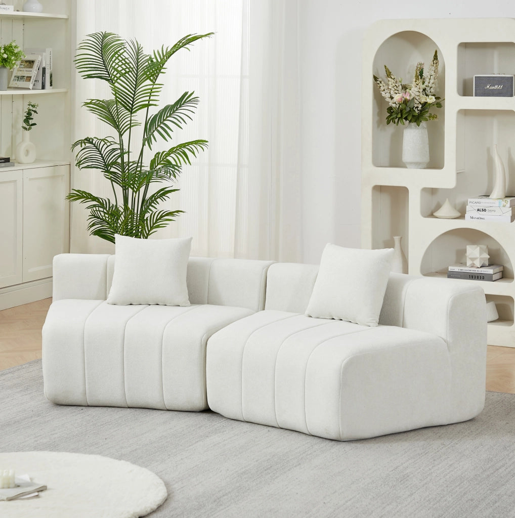 Divano modulare curvo in ciniglia beige con 2 cuscini