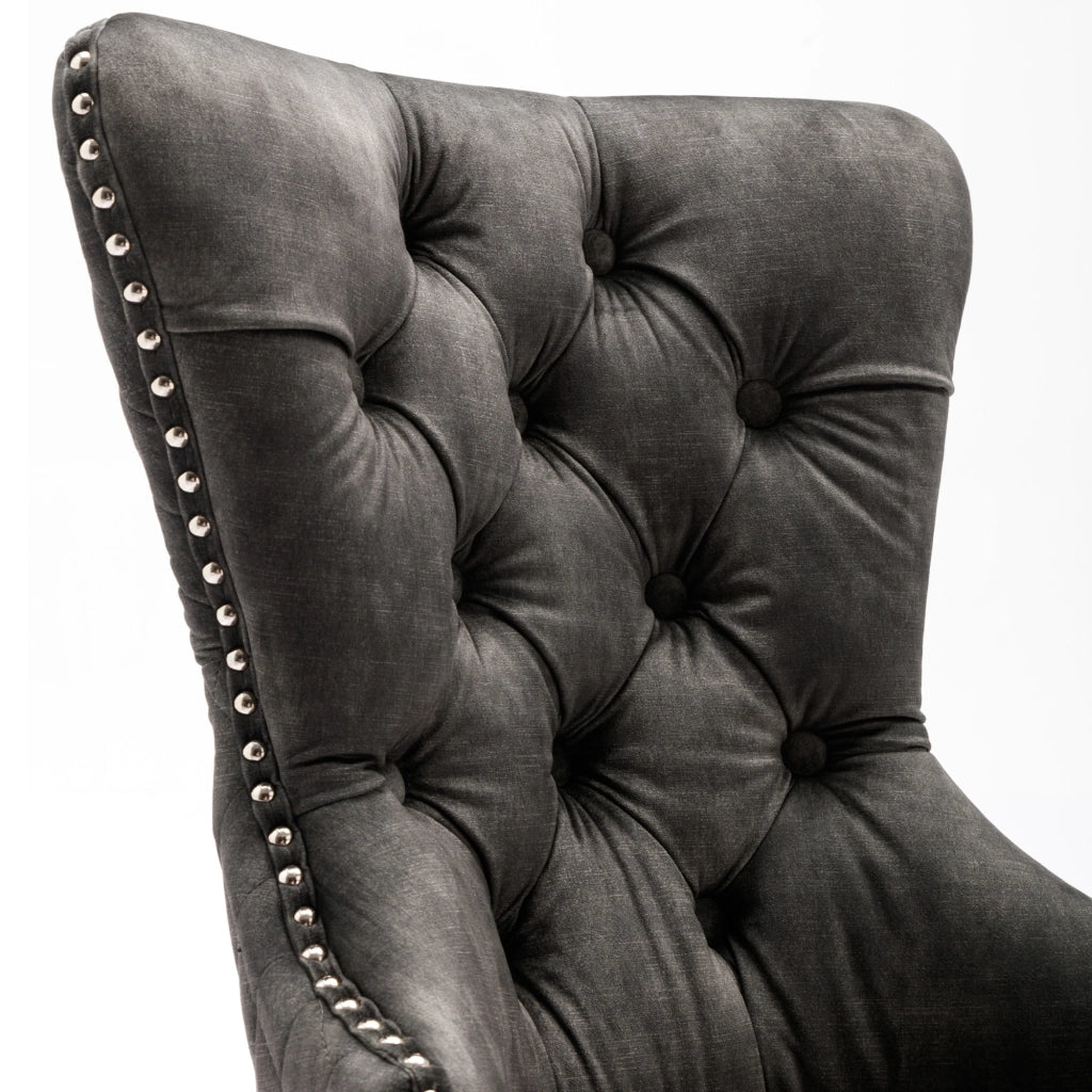 Sedia da pranzo imbottita con gambe regolabili, borchie decorative e anello posteriore, in velluto grigio
