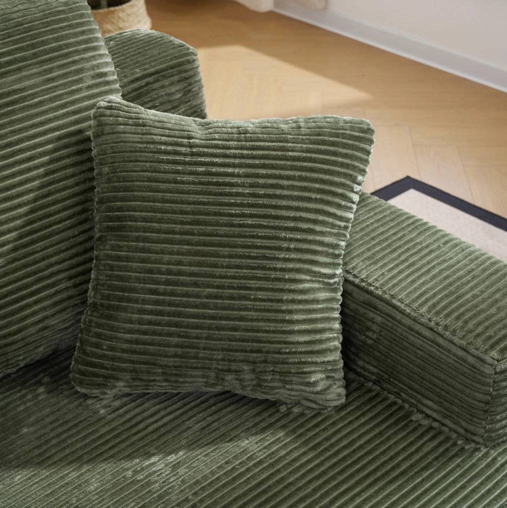 Divano compatto in velluto a coste verde con tasche laterali e imbottitura a molle per il relax