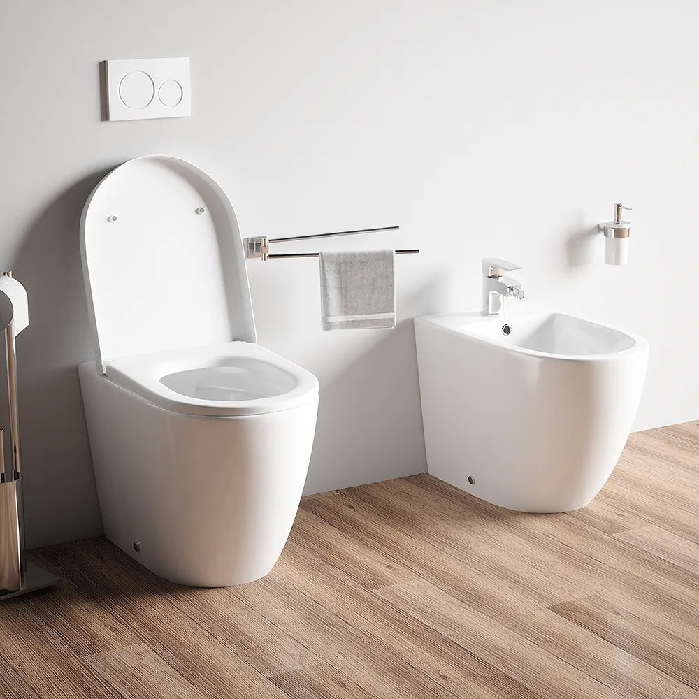 Sanitari filo muro in ceramica senza brida vaso traslato + bidet + sedile soft-close  | Roma