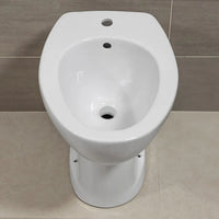 Coppia sanitari per disabili con apertura frontale e scarico a terra