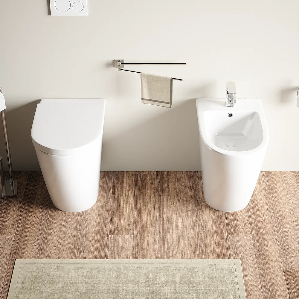 Coppia sanitari filomuro vaso rimless h 50 cm sedile soft-close e bidet | Roma Comfort