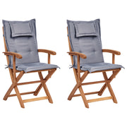 Set di 2 sedie da pranzo da giardino Legno chiaro con cuscino grigio Struttura in legno di acacia Design rustico pieghevole