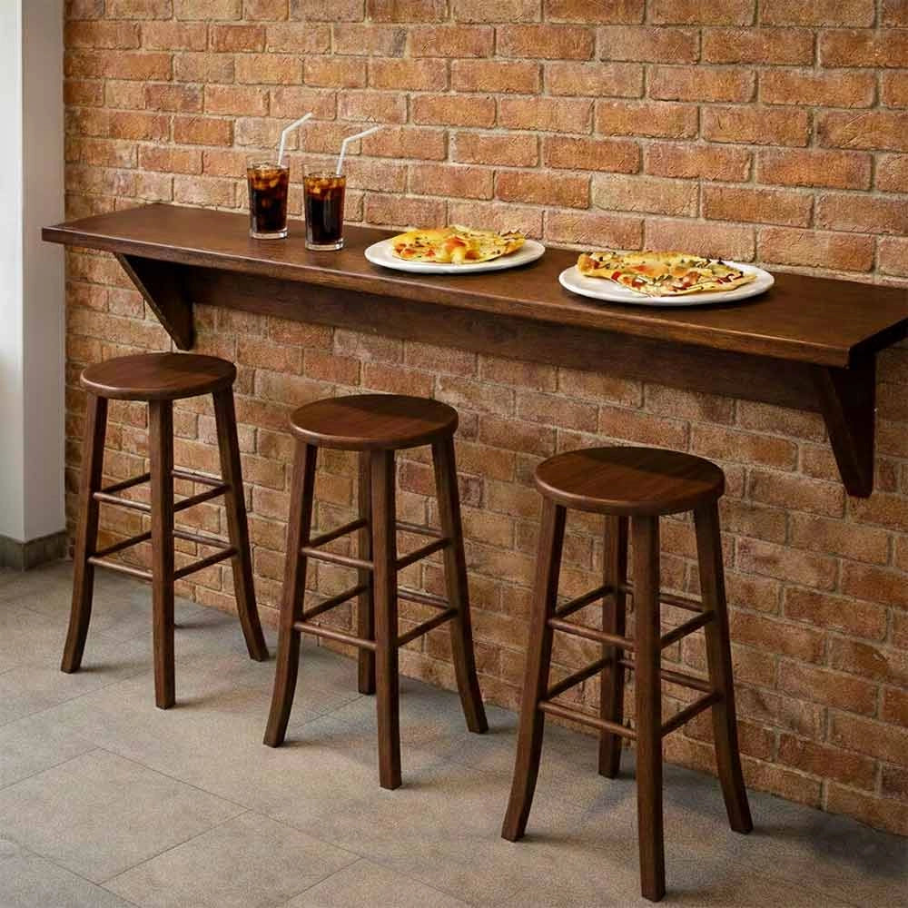 Sgabello di legno con seduta tonda h 67 noce scuro gambe a sciabola già montato