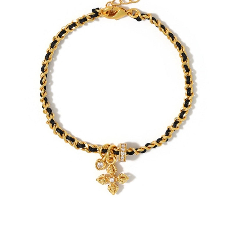 Bracciale intrecciato con zirconi a forma di croce e cuore, corda rossa e catena dorata