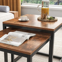 Set di due tavolini da salotto di colore marrone, misure 55/52/50 cm.