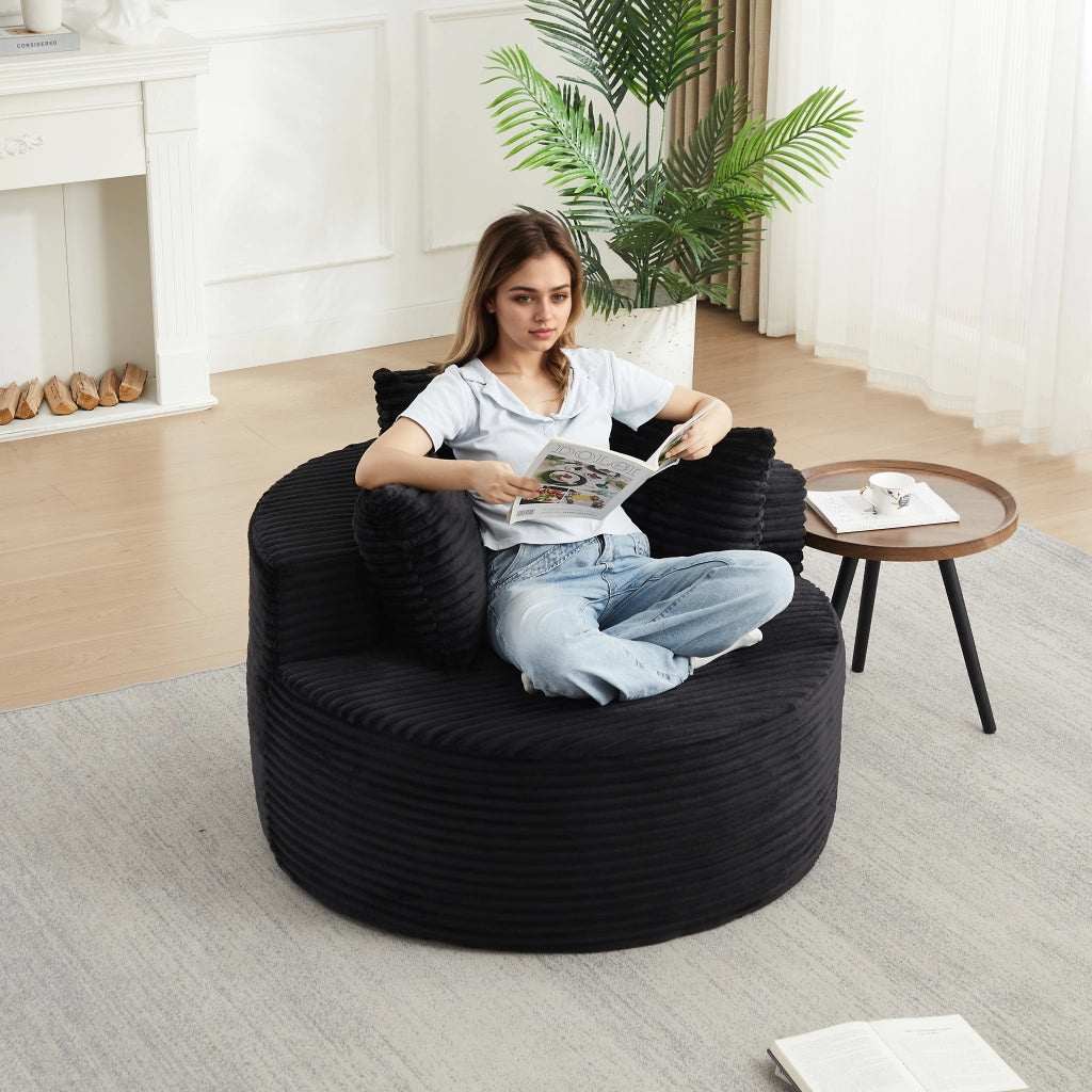 Fauteuil lounge rotondo con braccioli larghi e 3 cuscini, in velluto a coste e schiuma con molle nero 110 cm