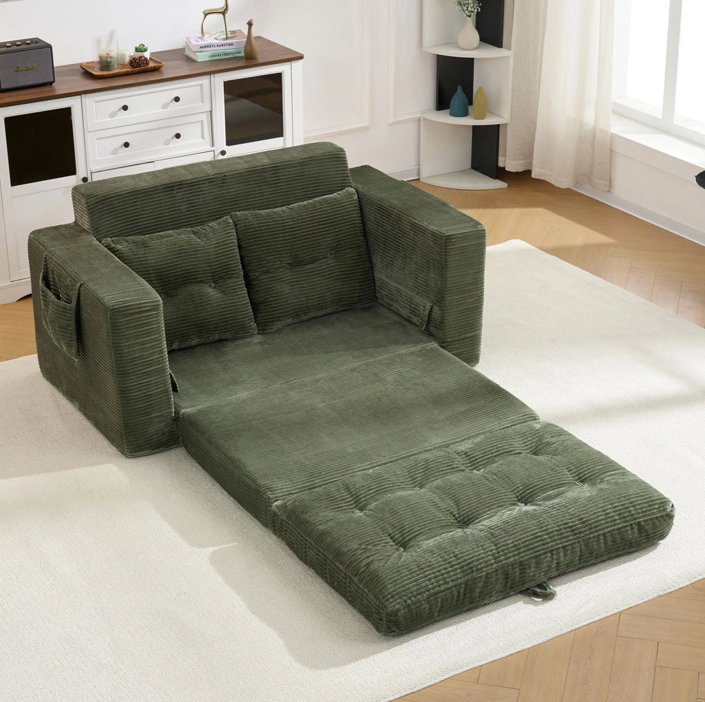 Divano 2 posti trasformabile in area relax; in velluto a coste verde con tasche laterali