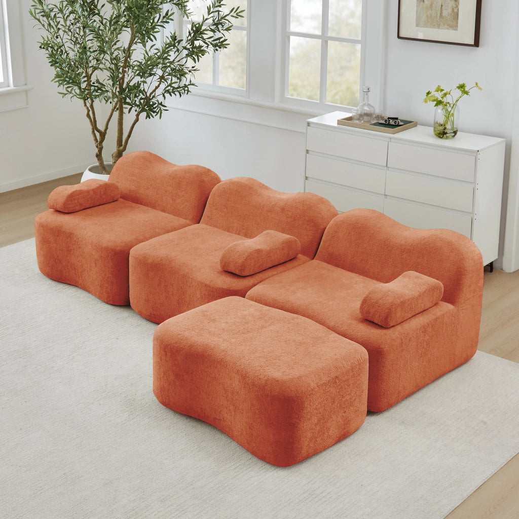 Divano angolare modulare senza struttura con pouf collegabile e seduta profonda in velluto arancione